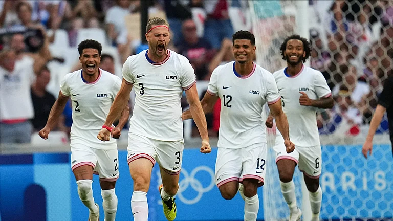 United States' Walker Zimmerman, center, celebrates after scoring his side's second goal during the men's Group A soccer match between New Zealand and the United States at the Velodrome stadium, during the 2024 Summer Olympics, Saturday, July 27, 2024, in Marseille, France. - (AP Photo/Daniel Cole)